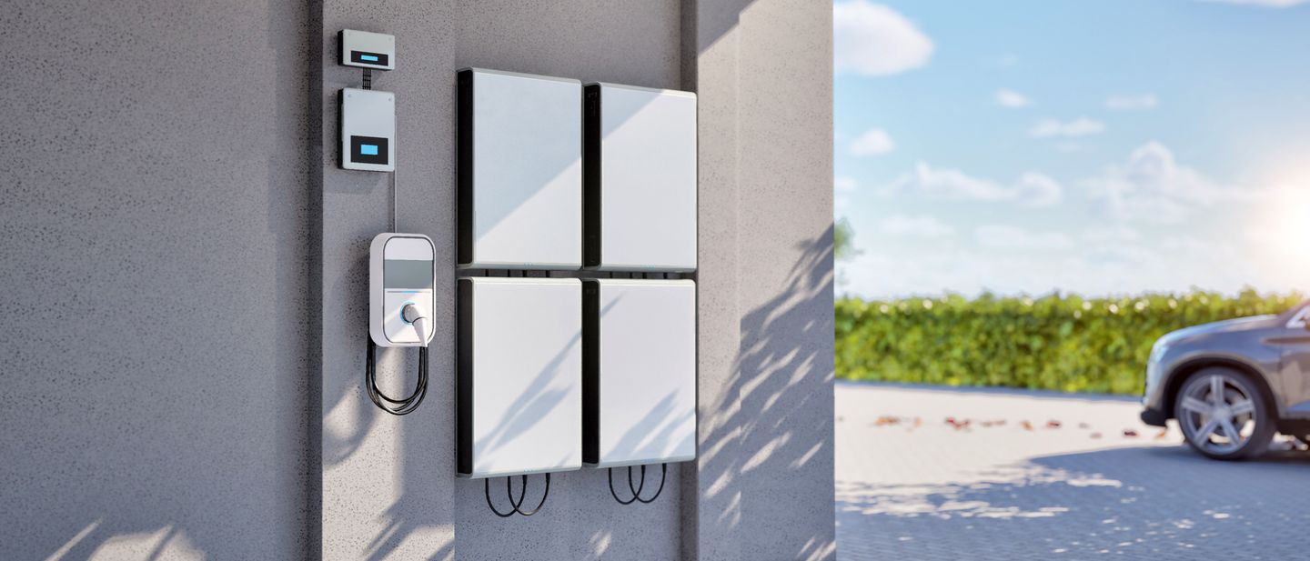 Level 2 EV chargers mounted on the wall of an open garage bay