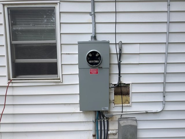 Exterior electrical service equipment and disconnects mounted on a Kernersville, NC home