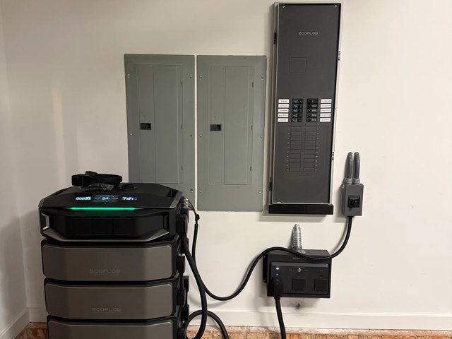 Home battery storage installed beside the electrical panels in an Advance, NC garage