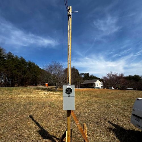 Temporary service pole and meter set on a rural Advance, NC lot