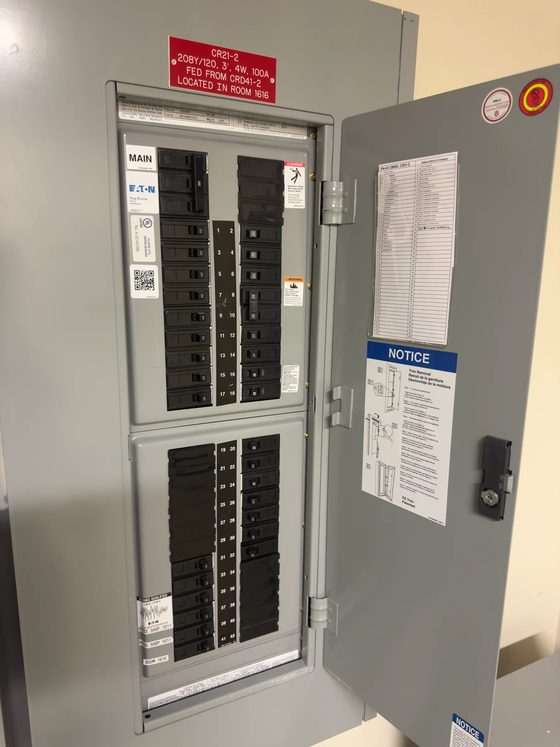 Panel with its full circuit directory and service notice posted inside the door after a changeout