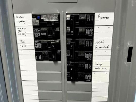 Open load center with hand-labelled branch circuits